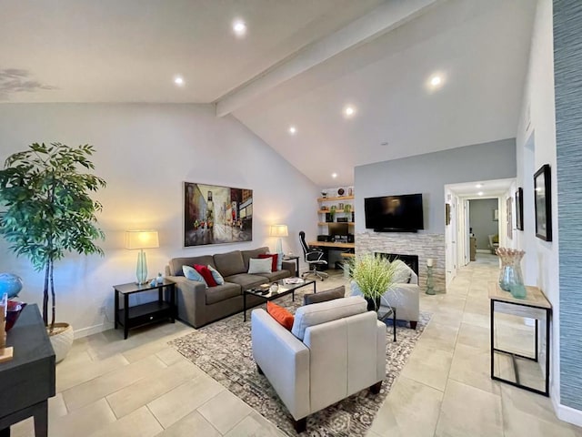 living room with beam ceiling, a stone fireplace, and high vaulted ceiling