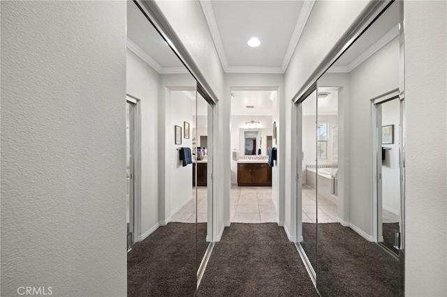 corridor with light colored carpet and crown molding