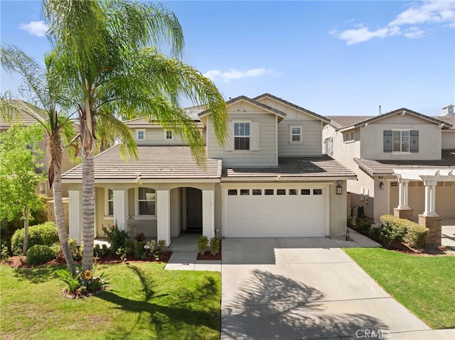 view of front of house featuring a garage and a front yard