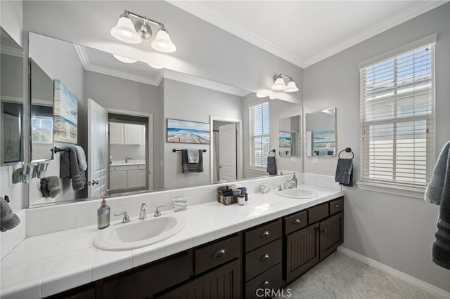 bathroom with vanity and ornamental molding