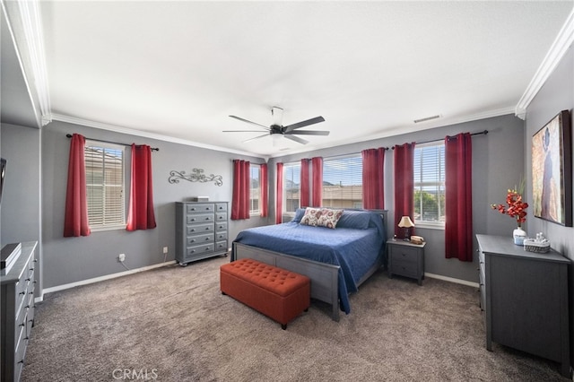 carpeted bedroom with ceiling fan and ornamental molding