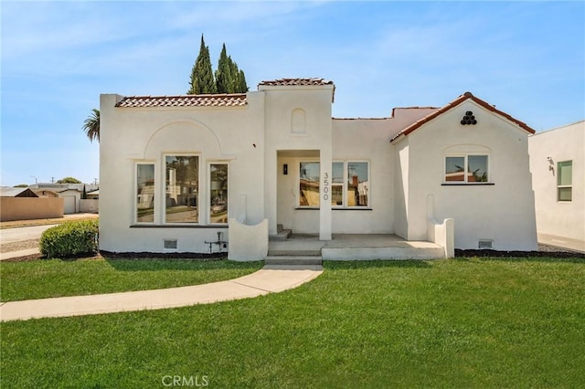 rear view of house with a lawn