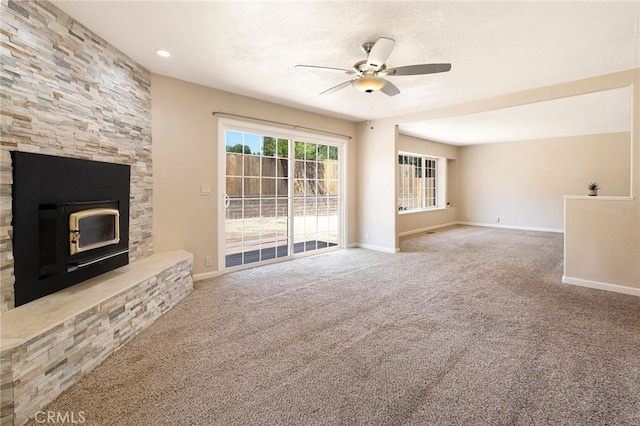 unfurnished living room with carpet floors and ceiling fan