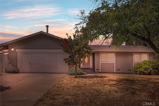 ranch-style house with a lawn