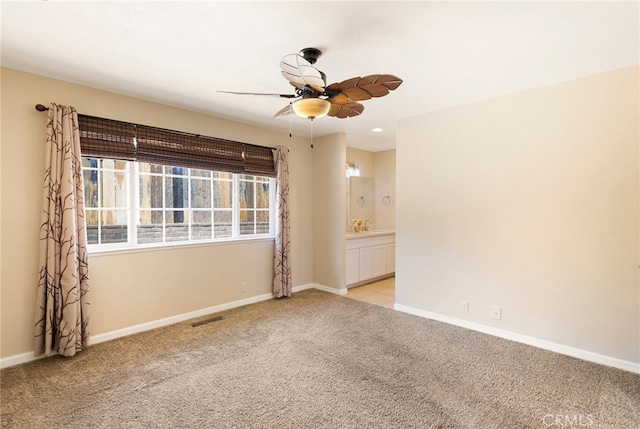 carpeted empty room with ceiling fan