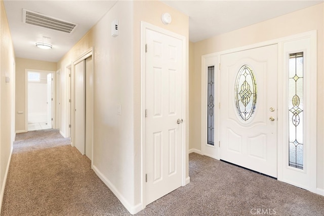 foyer with light carpet