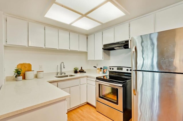 kitchen featuring sink, light wood-type flooring, white cabinetry, and stainless steel appliances