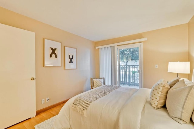 bedroom featuring light hardwood / wood-style floors and access to outside