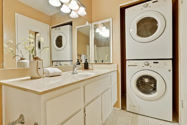 laundry area featuring sink and stacked washing maching and dryer