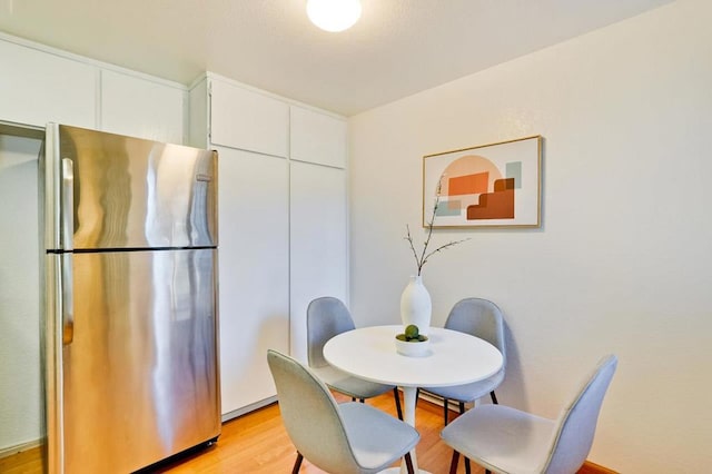 dining room with light wood-type flooring