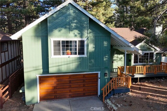 view of home's exterior featuring a deck and a garage