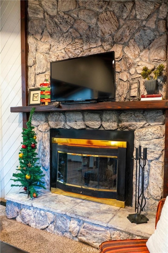 room details featuring a stone fireplace