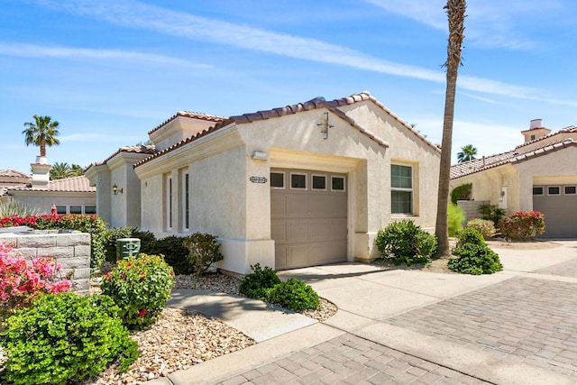 mediterranean / spanish house featuring a garage