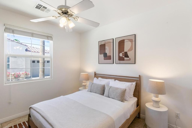 bedroom featuring ceiling fan and tile patterned flooring