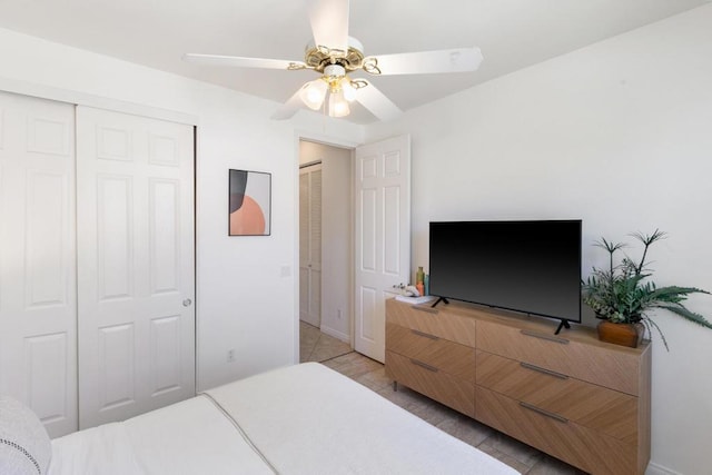 tiled bedroom with ceiling fan