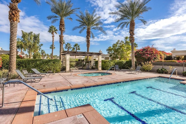 view of pool with a pergola, a community hot tub, and a patio