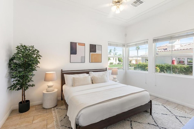 tiled bedroom with ceiling fan