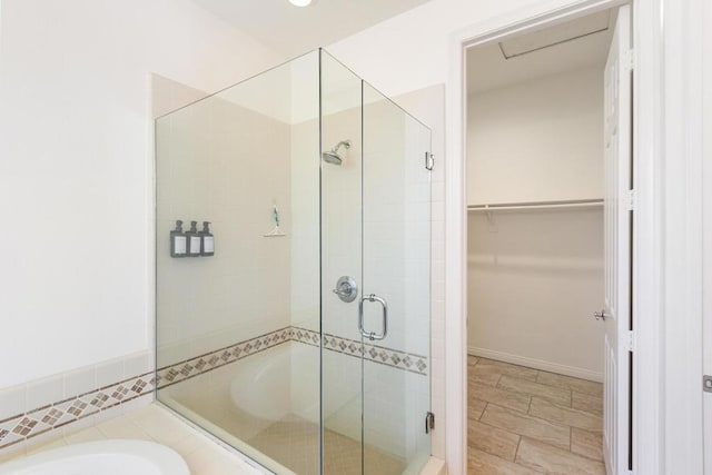 bathroom with separate shower and tub