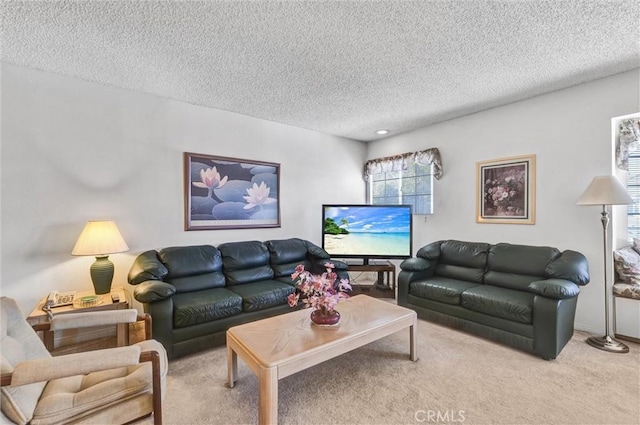 carpeted living room featuring a textured ceiling