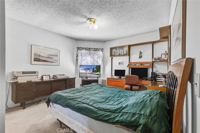 carpeted bedroom featuring a textured ceiling