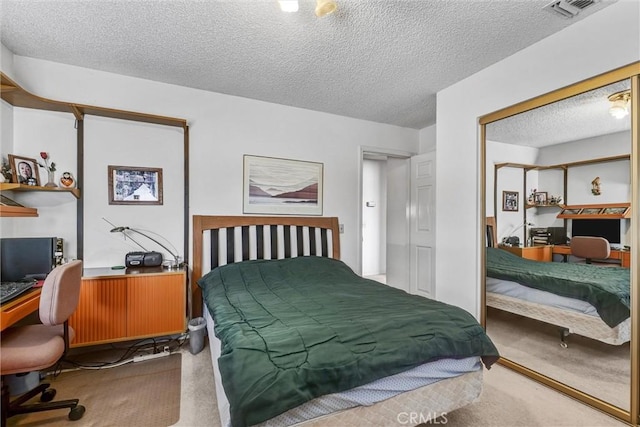 carpeted bedroom featuring a textured ceiling and radiator