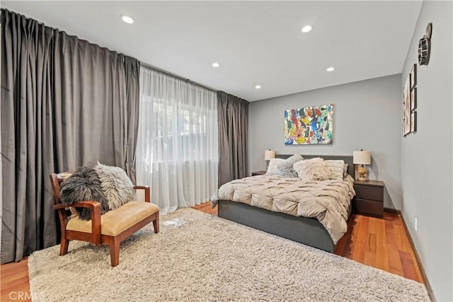 bedroom with hardwood / wood-style floors