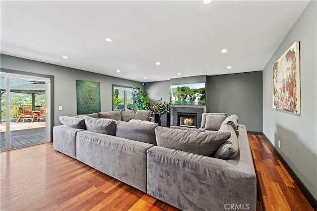 living room featuring light hardwood / wood-style flooring and a wealth of natural light