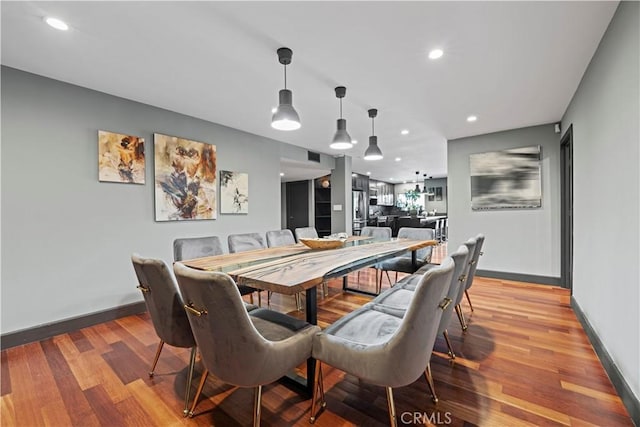 dining area with hardwood / wood-style flooring