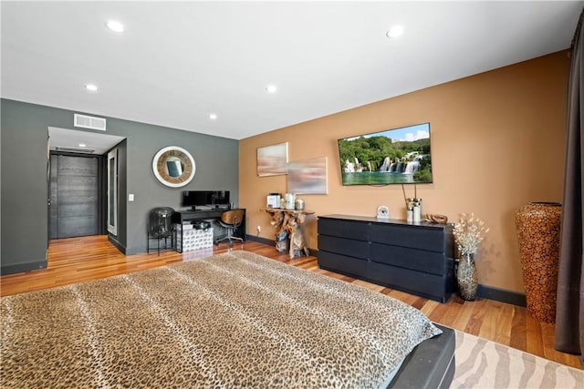 bedroom featuring light hardwood / wood-style floors