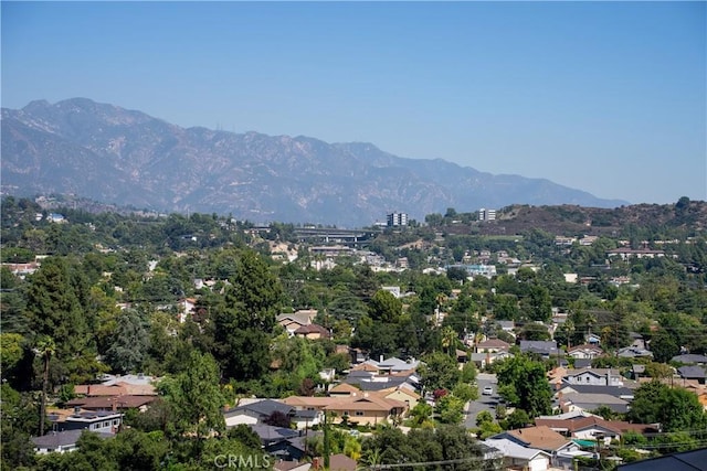 birds eye view of property featuring a mountain view