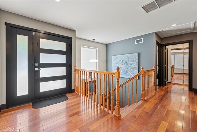 foyer entrance featuring wood-type flooring