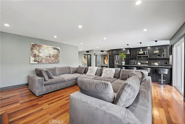 living room with light hardwood / wood-style flooring