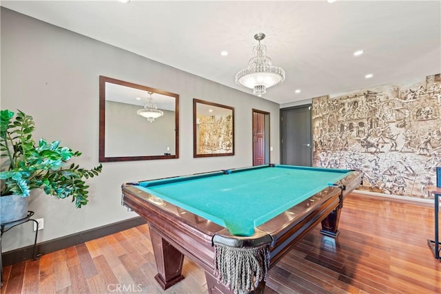 recreation room with hardwood / wood-style flooring and pool table