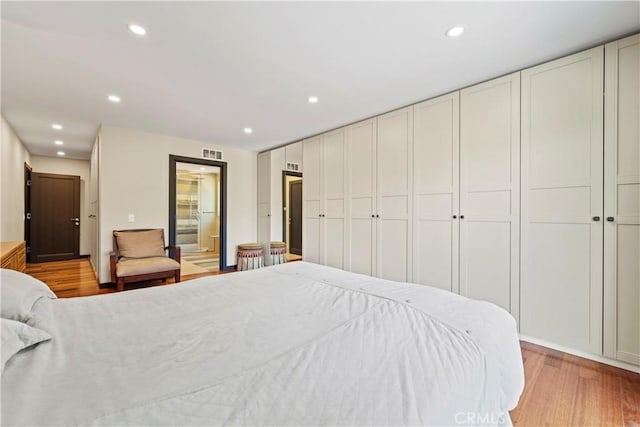 bedroom with light hardwood / wood-style flooring