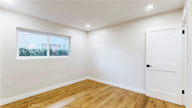 spare room featuring hardwood / wood-style flooring