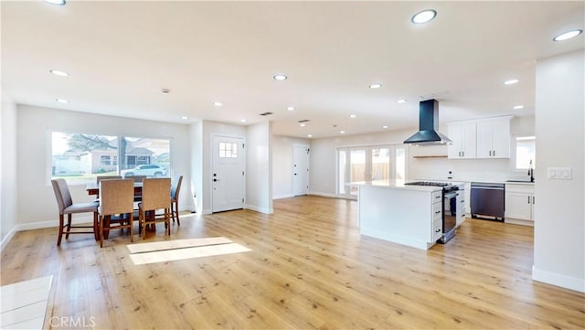 kitchen with extractor fan, gas stove, light wood-type flooring, white cabinets, and dishwashing machine