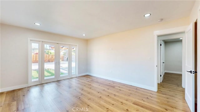 unfurnished room featuring light hardwood / wood-style floors