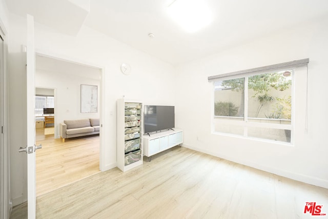 unfurnished living room with light hardwood / wood-style flooring