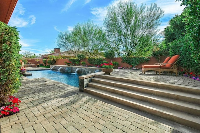 view of pool featuring a patio area and pool water feature