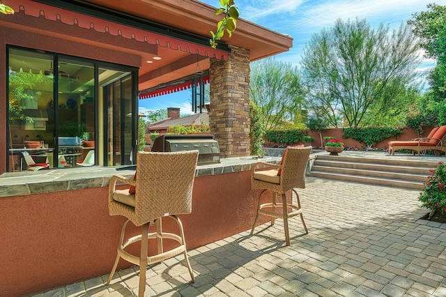 view of patio / terrace with an outdoor kitchen