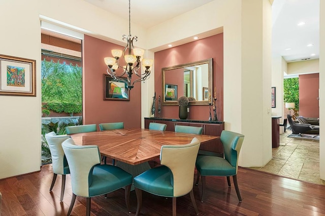 dining space with a chandelier and wood-type flooring