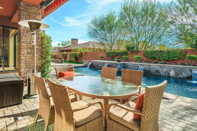 view of patio with pool water feature, a fenced in pool, and central air condition unit