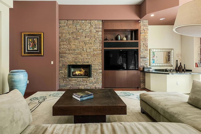 living room featuring a fireplace and light wood-type flooring