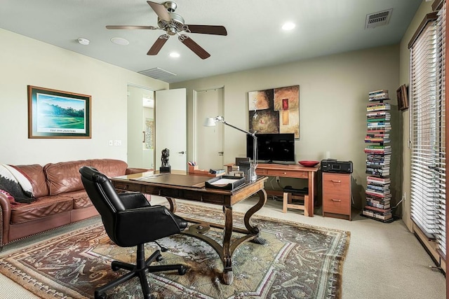 home office featuring carpet and ceiling fan