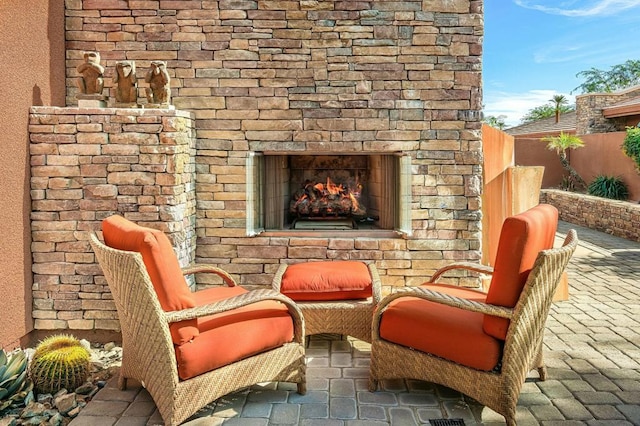 exterior space with an outdoor stone fireplace