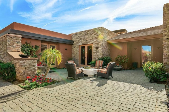 view of patio / terrace featuring an outdoor living space and french doors