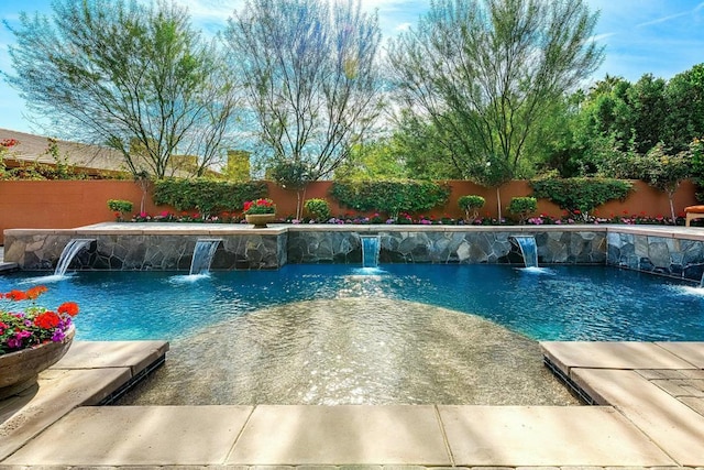 view of swimming pool featuring pool water feature