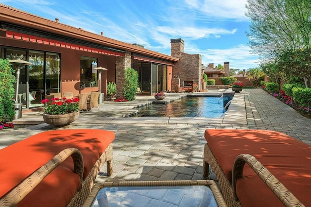 view of pool featuring a patio