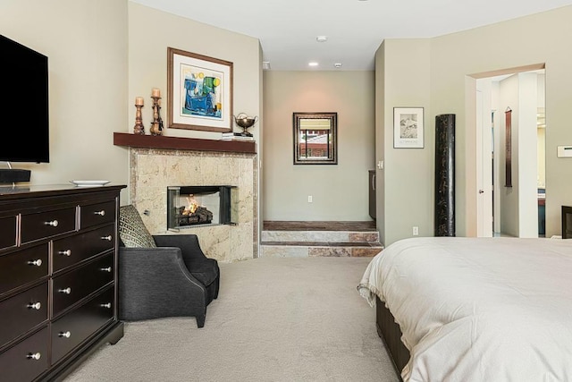 carpeted bedroom with a multi sided fireplace