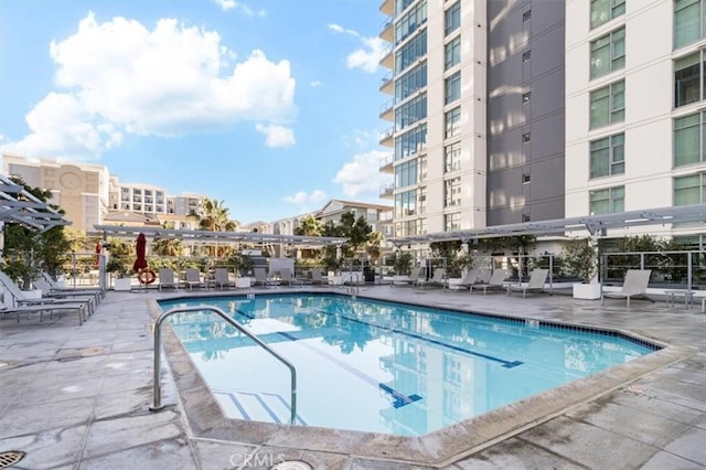 view of swimming pool with a patio area